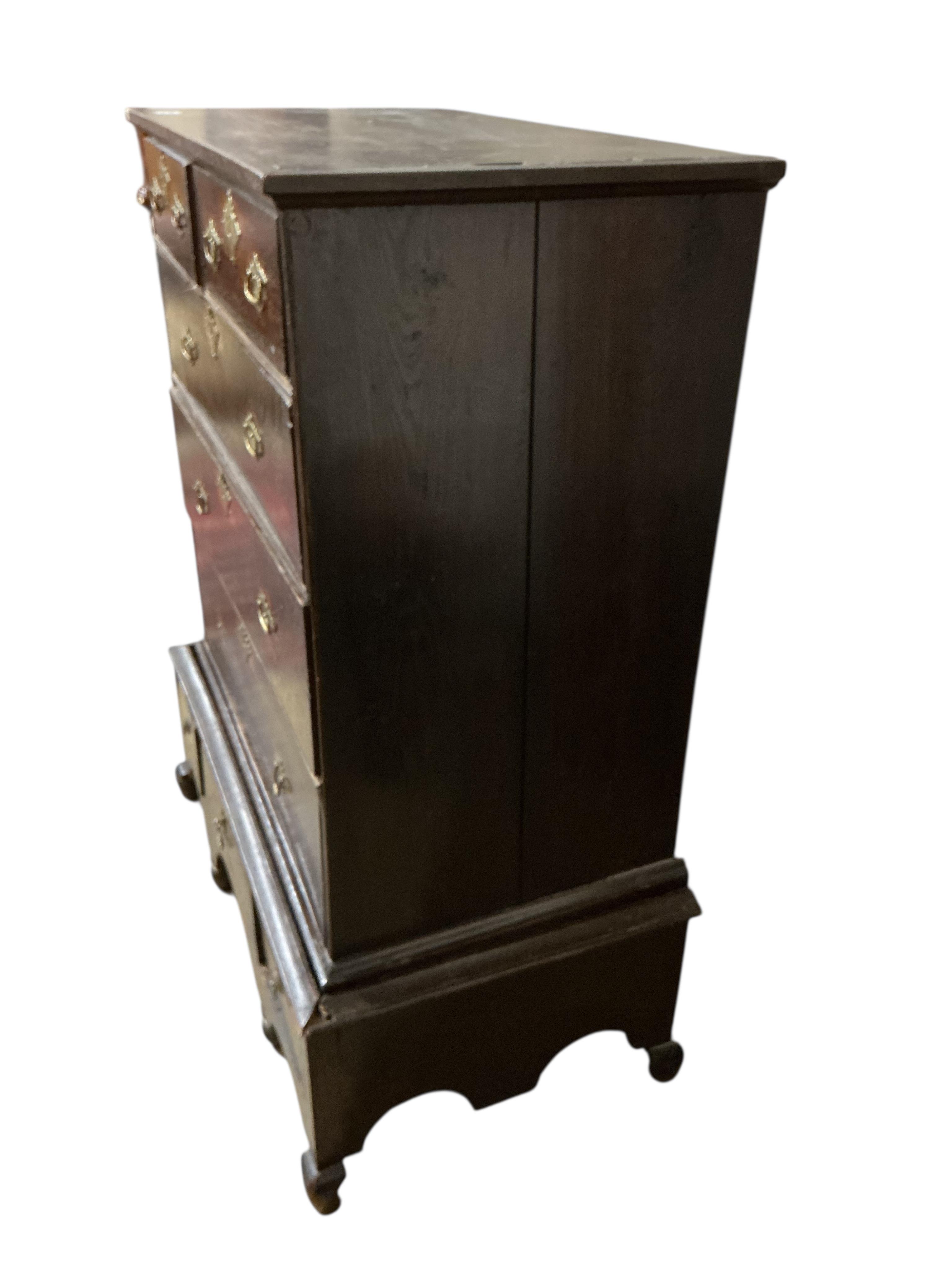 A William and Mary oak chest on stand, cut down base, width 90cm, depth 52cm, height 117cm